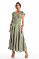 Woman wearing a long V-neck khaki dress with short sleeves on a white background