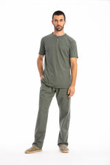 Man wearing a gray t-shirt and pants on a white background