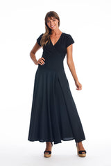 Woman wearing a long V-neck black dress with short sleeves on a white background
