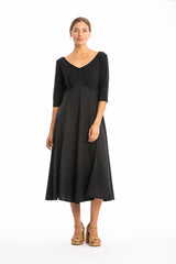 Woman wearing a black dress on a white background